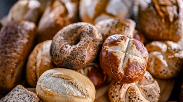 Assorted bakery products including loaves of bread and rolls